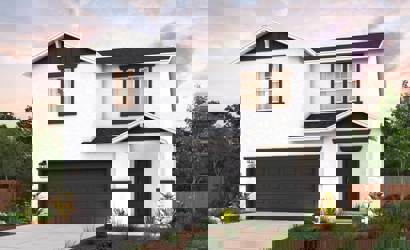 A white house with a garage.