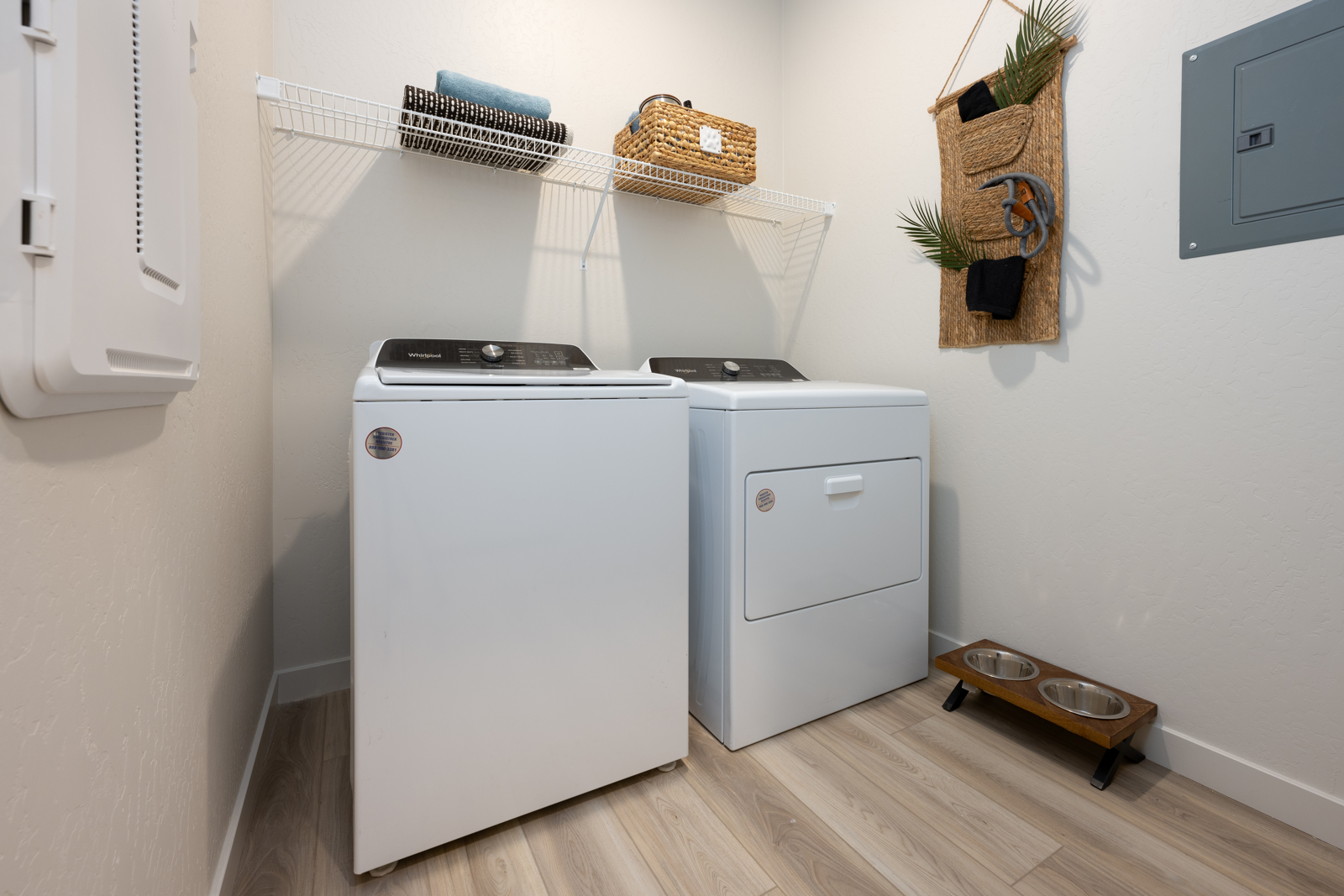 A kitchen with a washer and dryer.