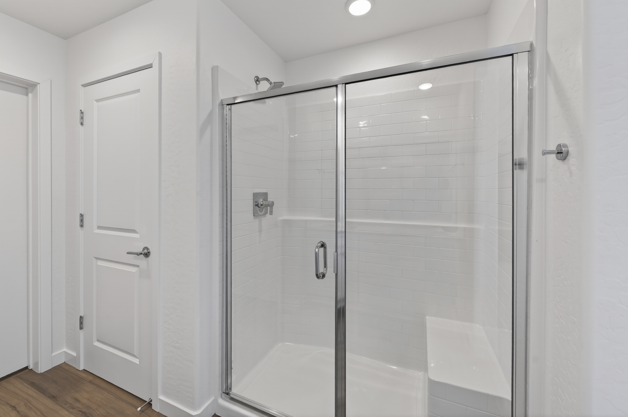 A shower with a glass door.