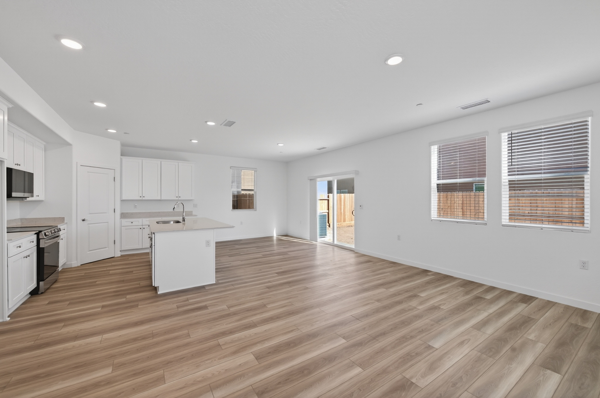 A large kitchen with white cabinets.