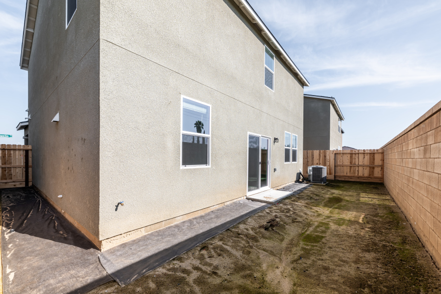 A white building with a fence.