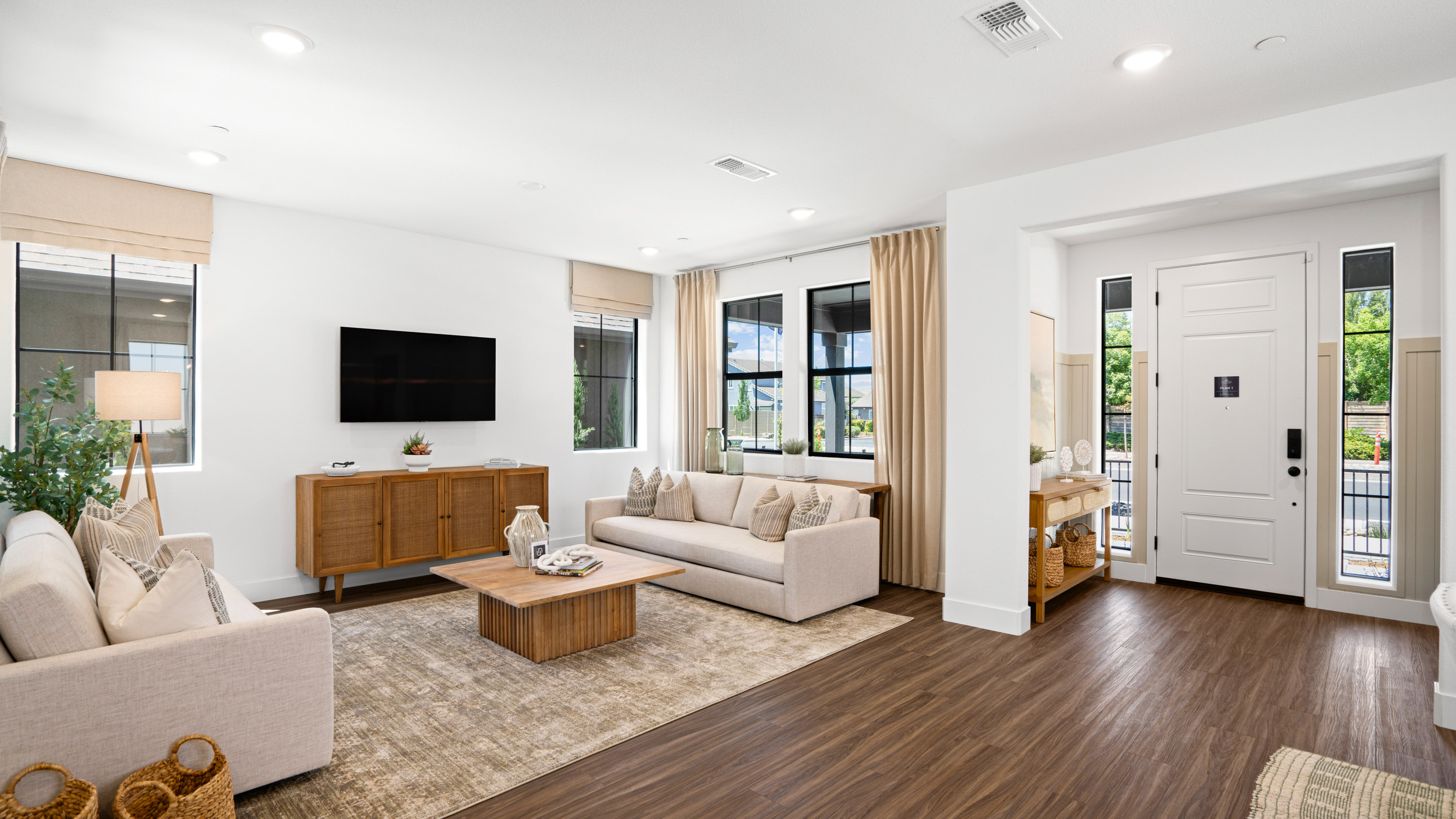 A living room with a wood floor.