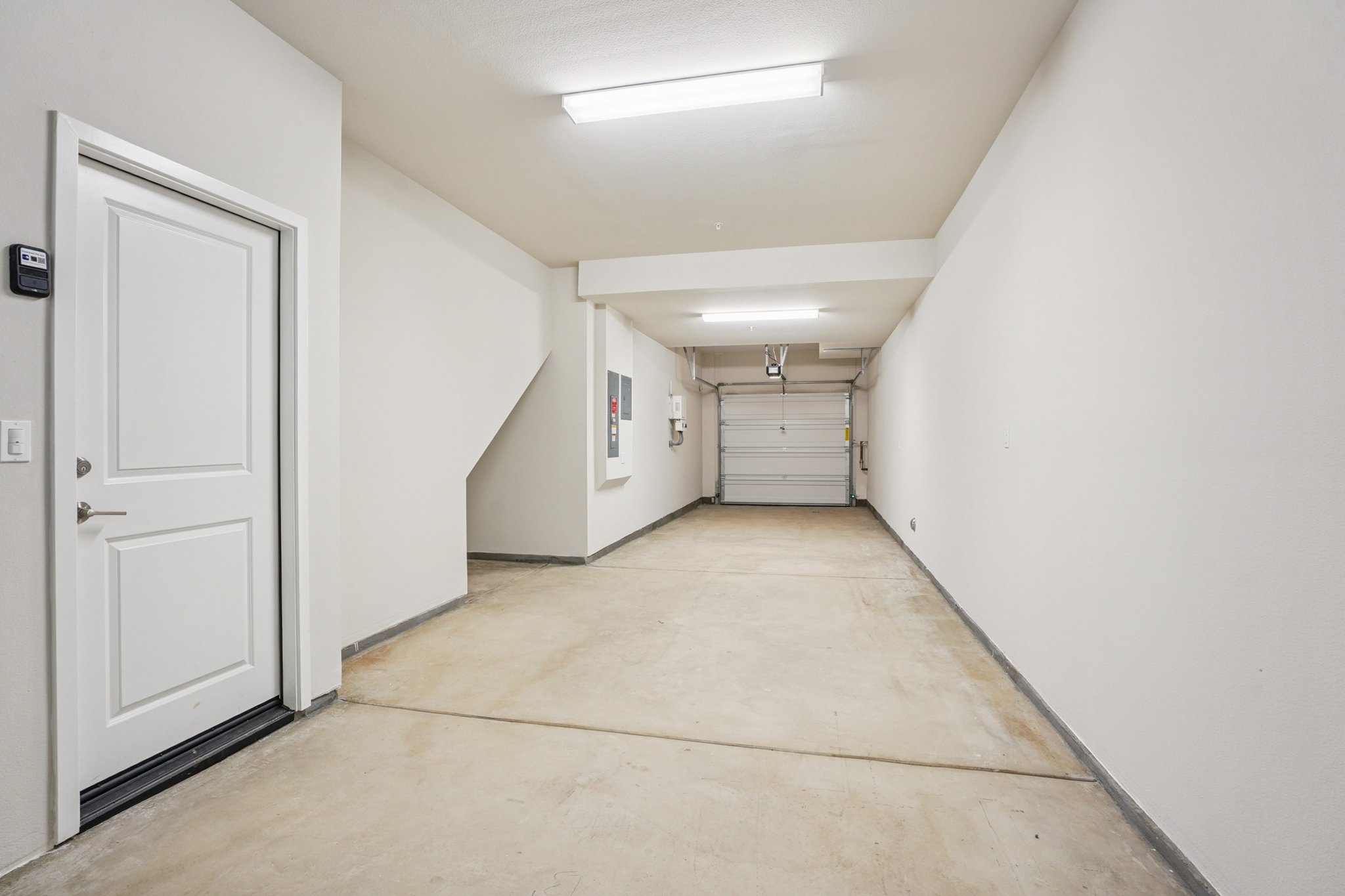 A hallway with white doors.