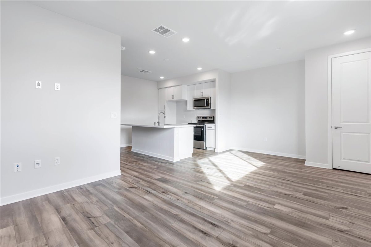 A kitchen with white walls.