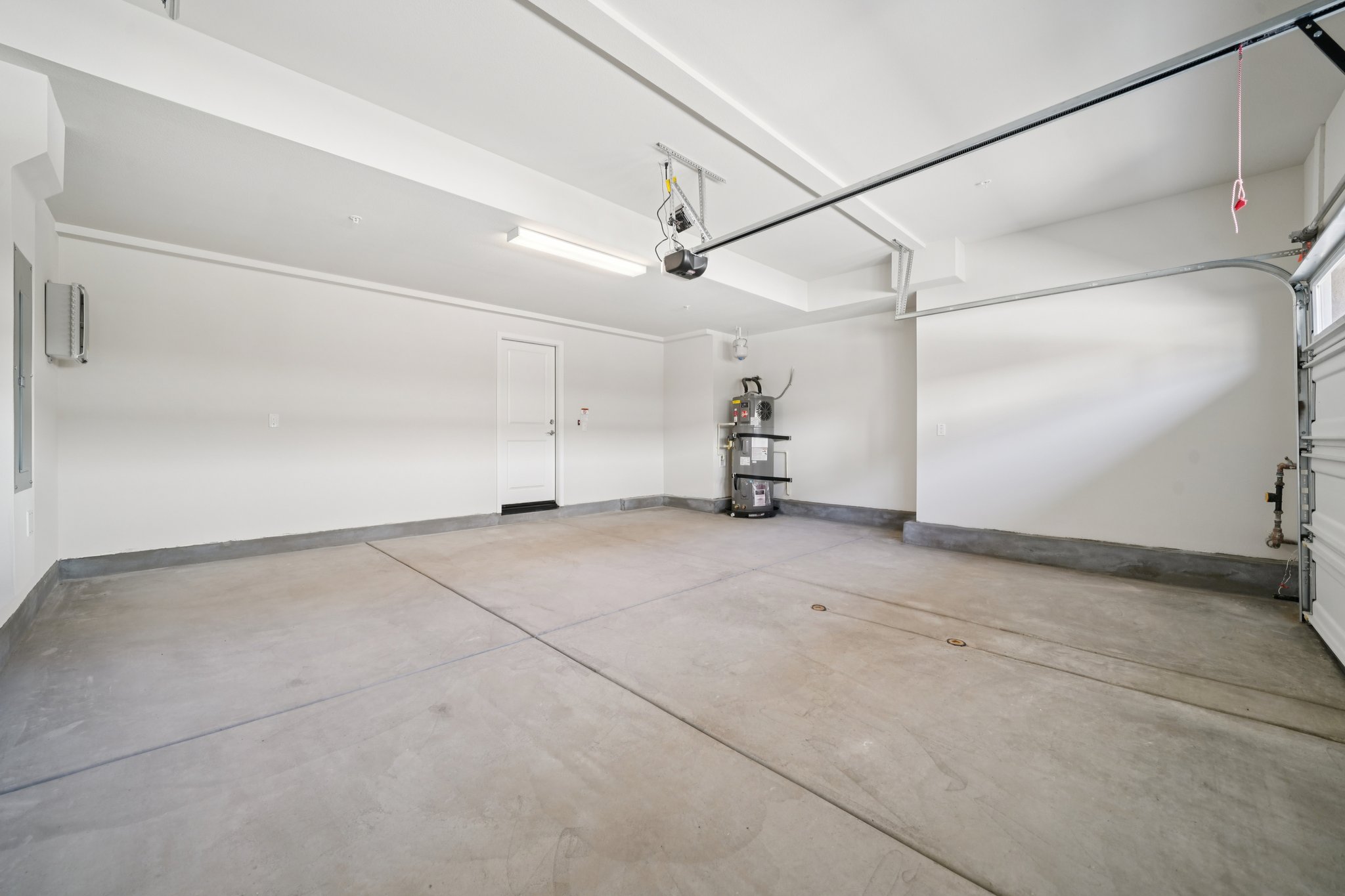 A room with a wood floor and white walls.