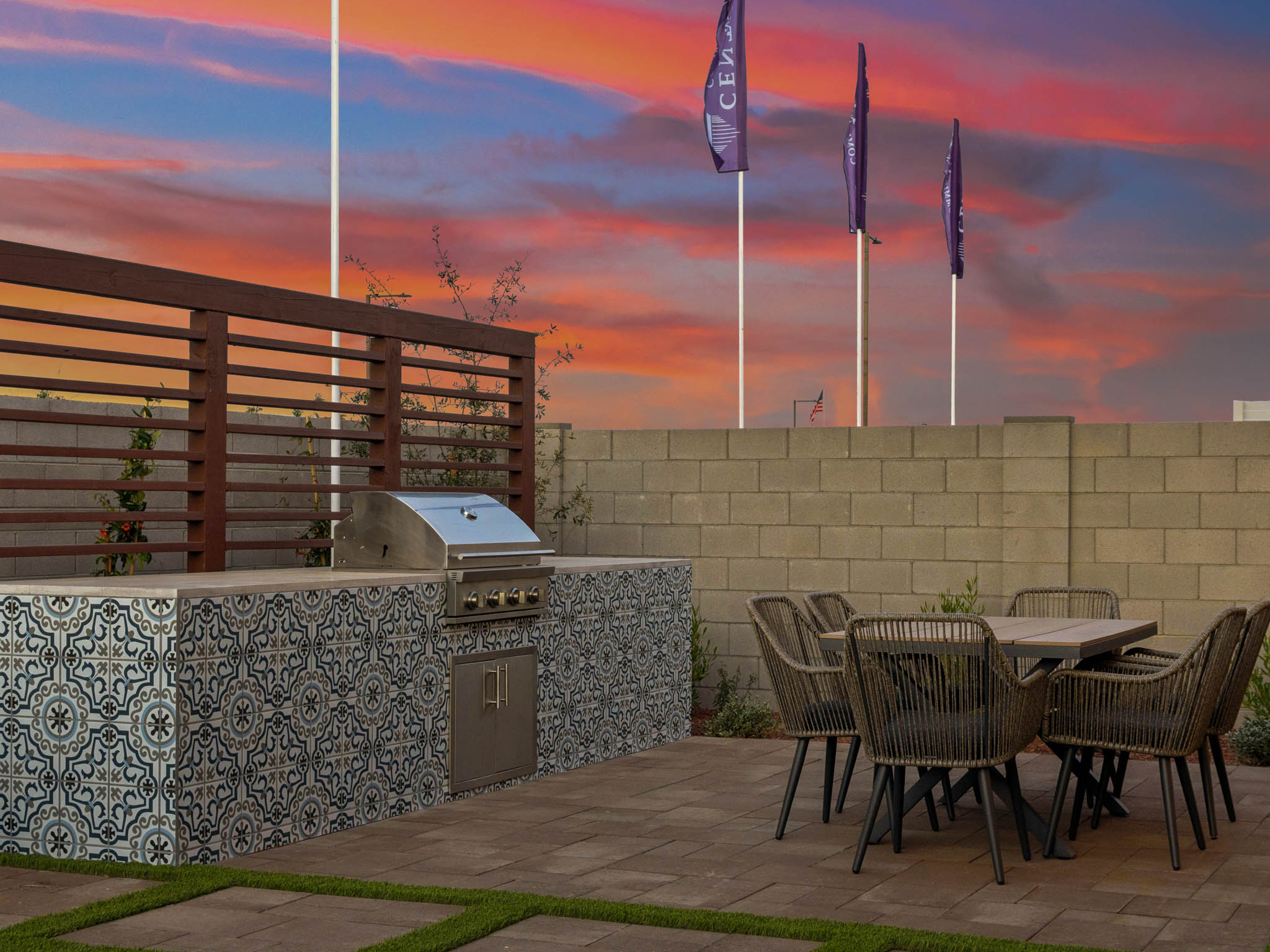 A patio with a table and chairs.