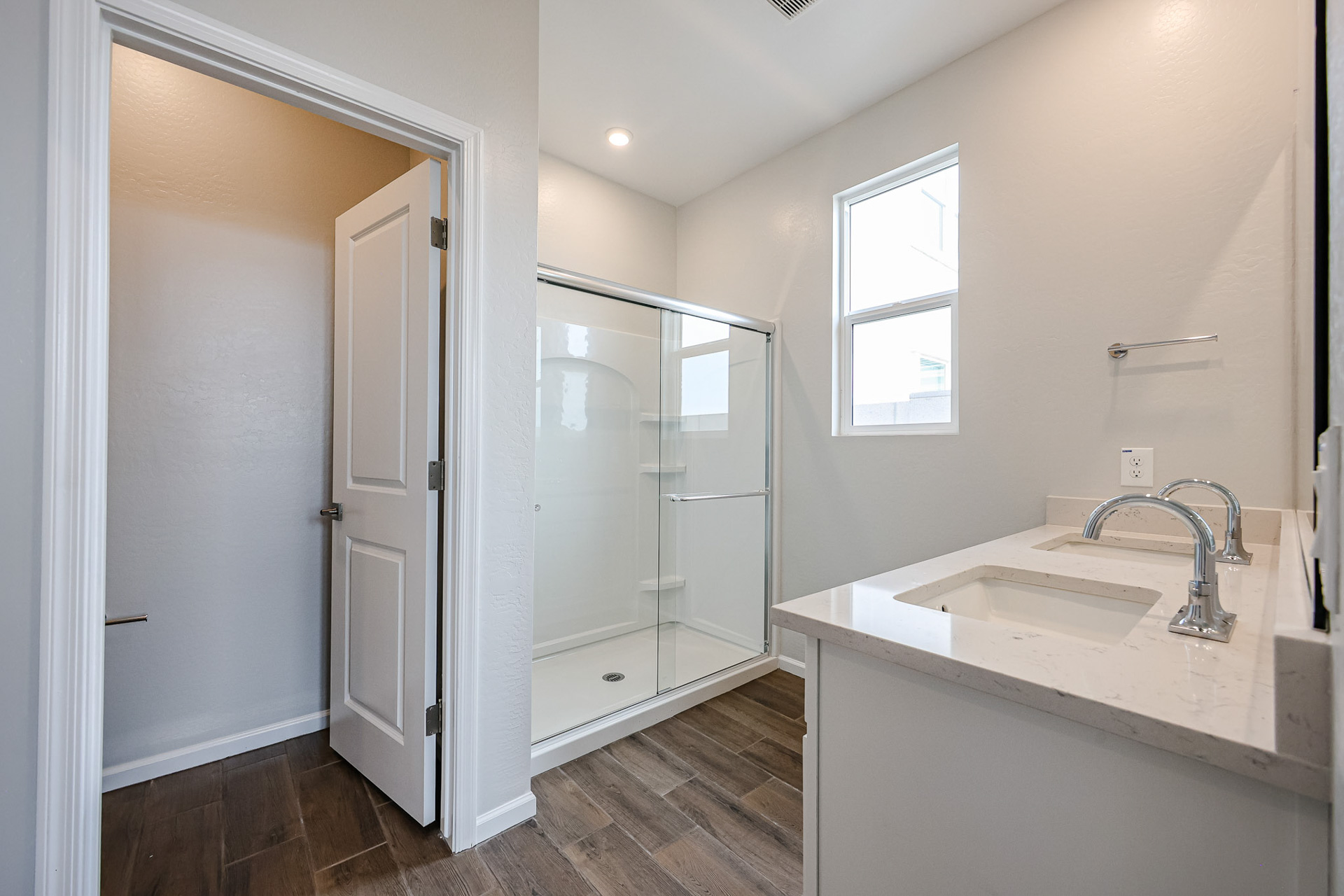 A bathroom with a glass shower.