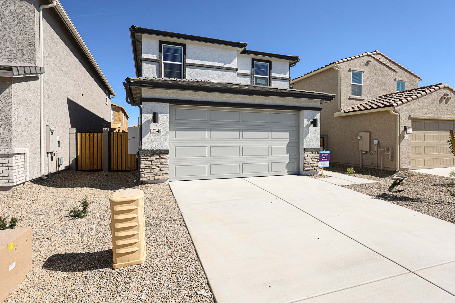 A driveway leading to a house.