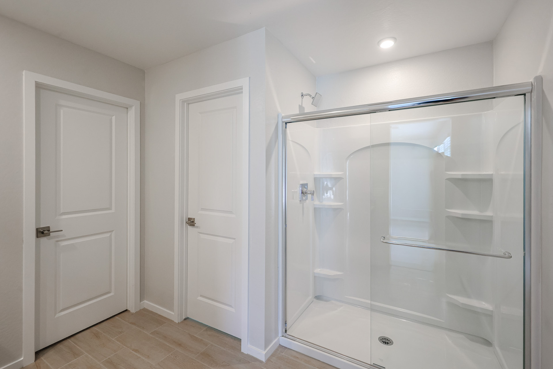 A bathroom with a glass shower.