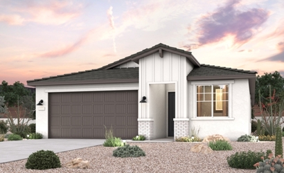 A house with a gravel driveway.