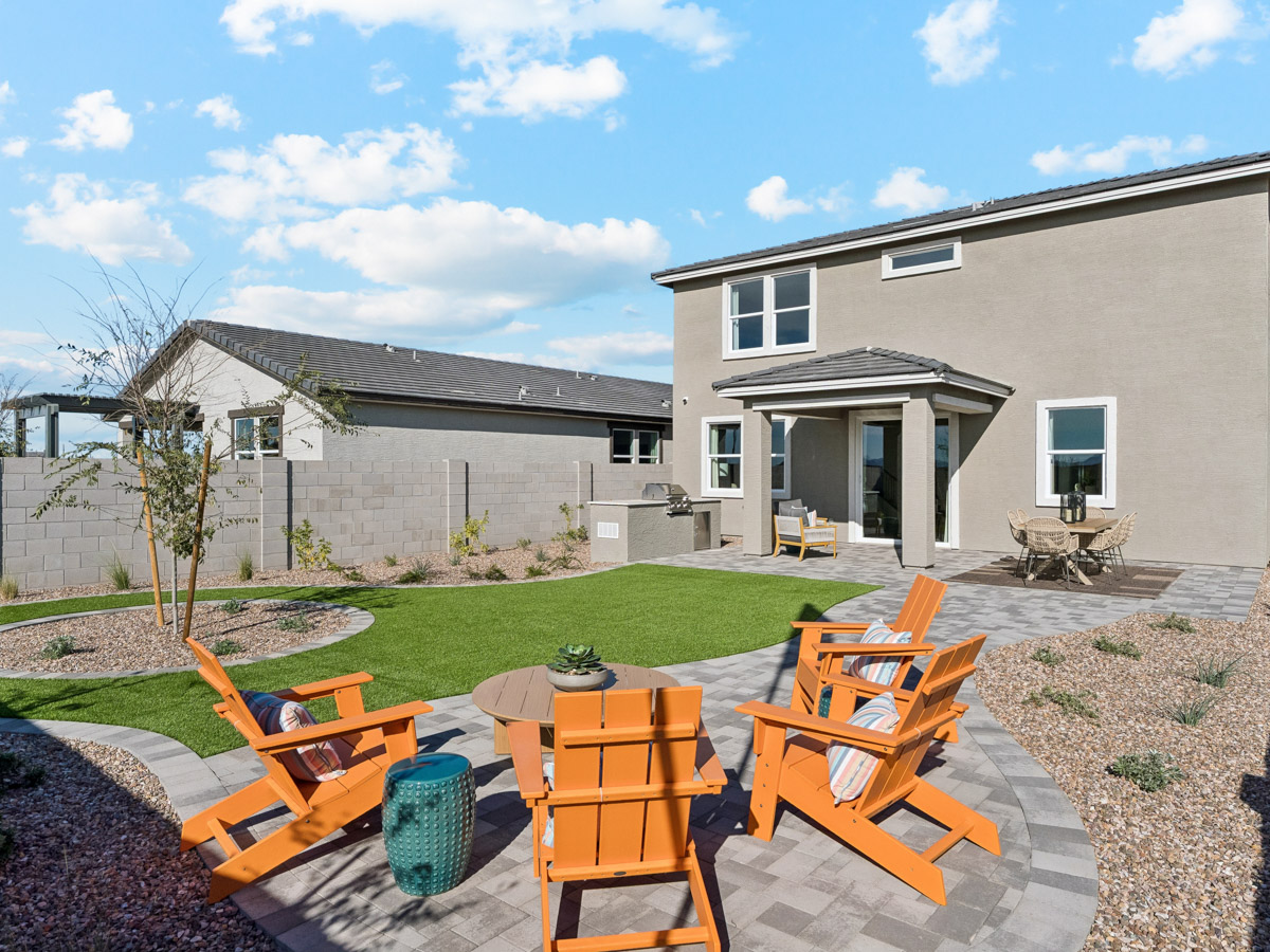 A patio with chairs and tables.