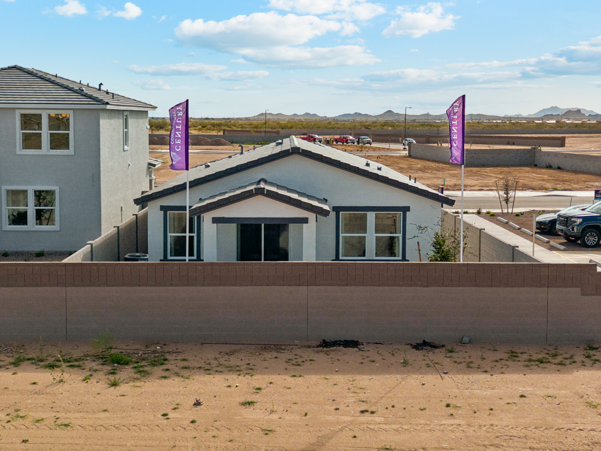 A building with a flag in front.