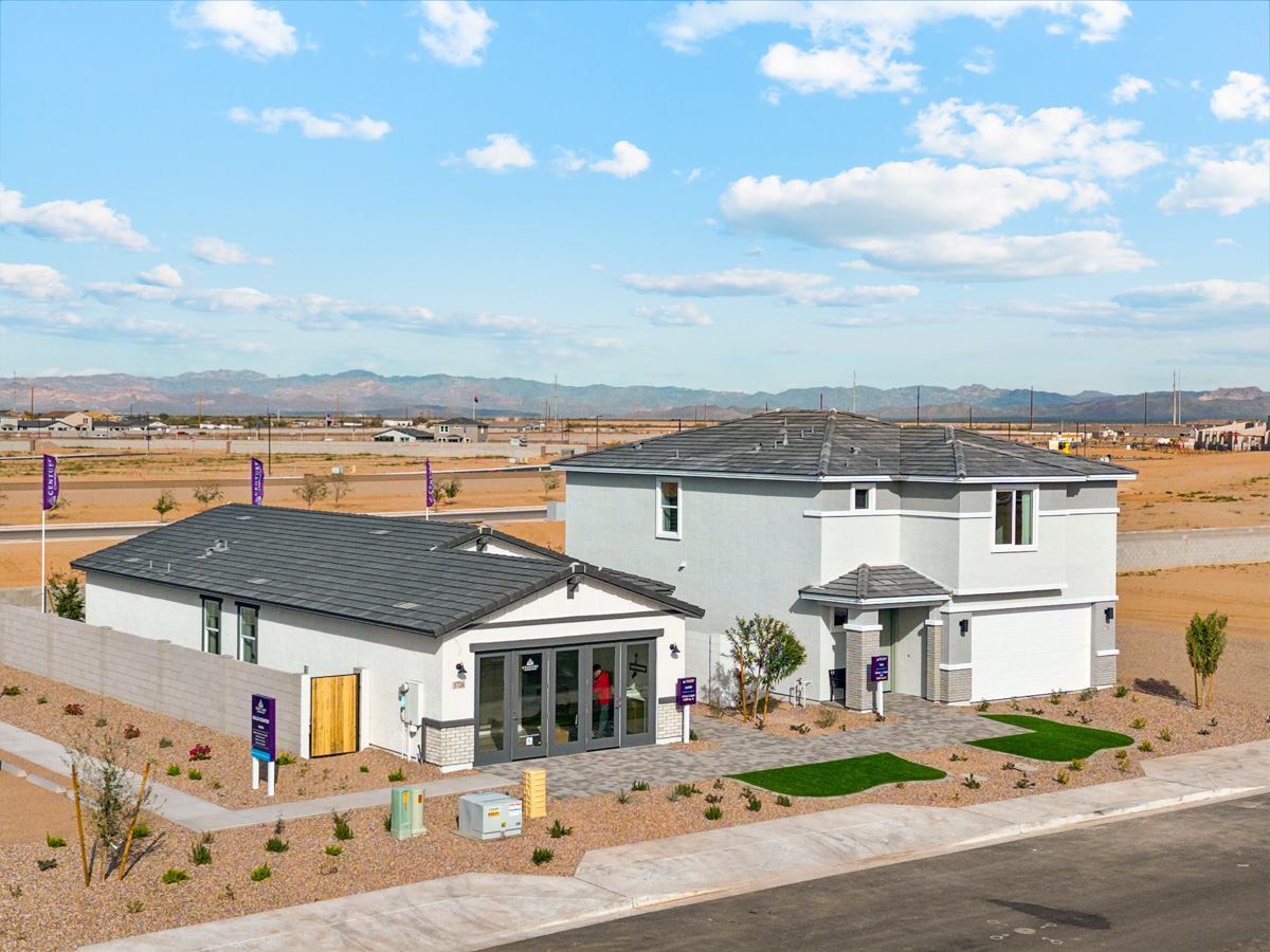 A group of buildings with a road in the front.