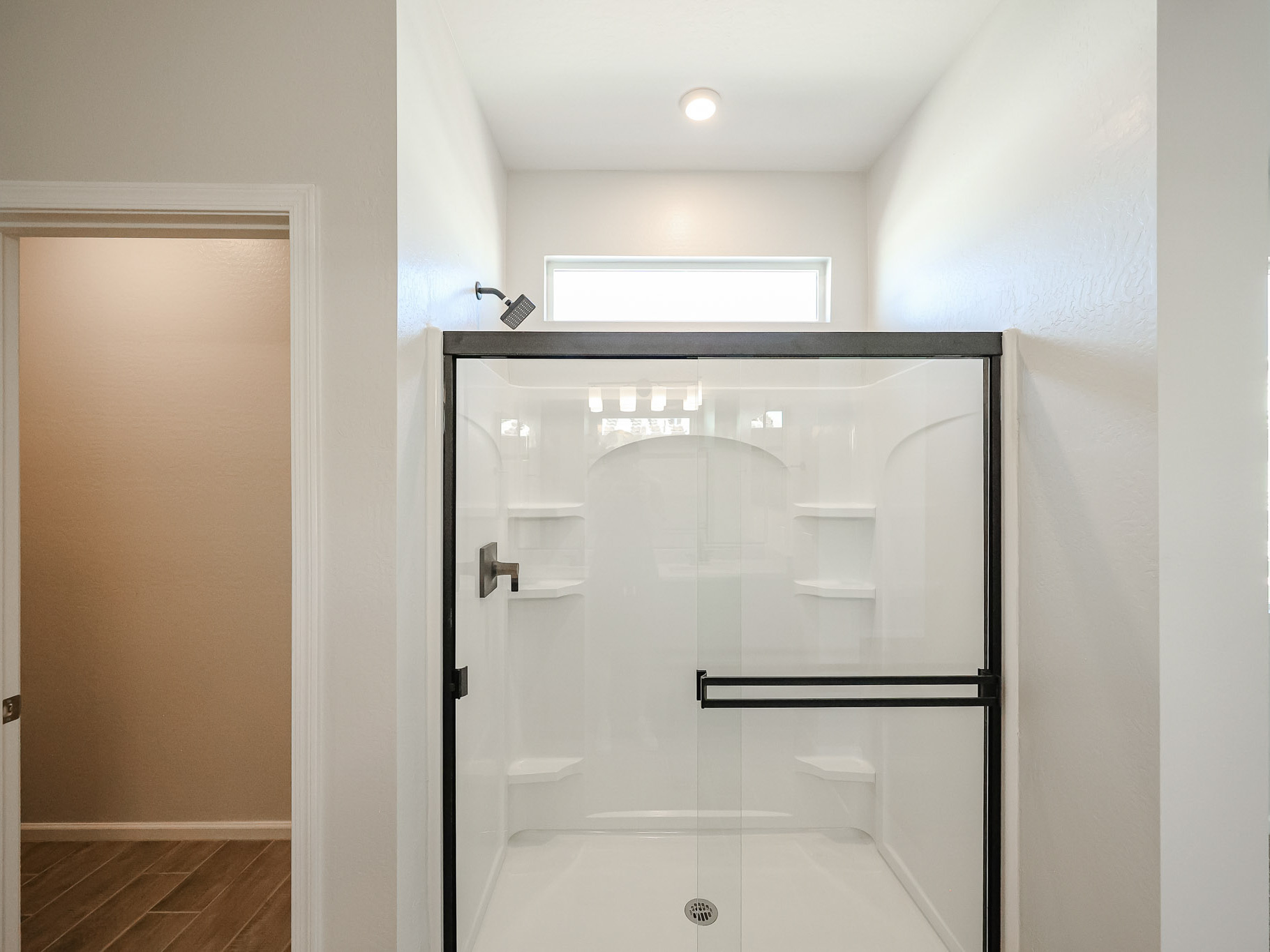 A bathroom with a glass shower.