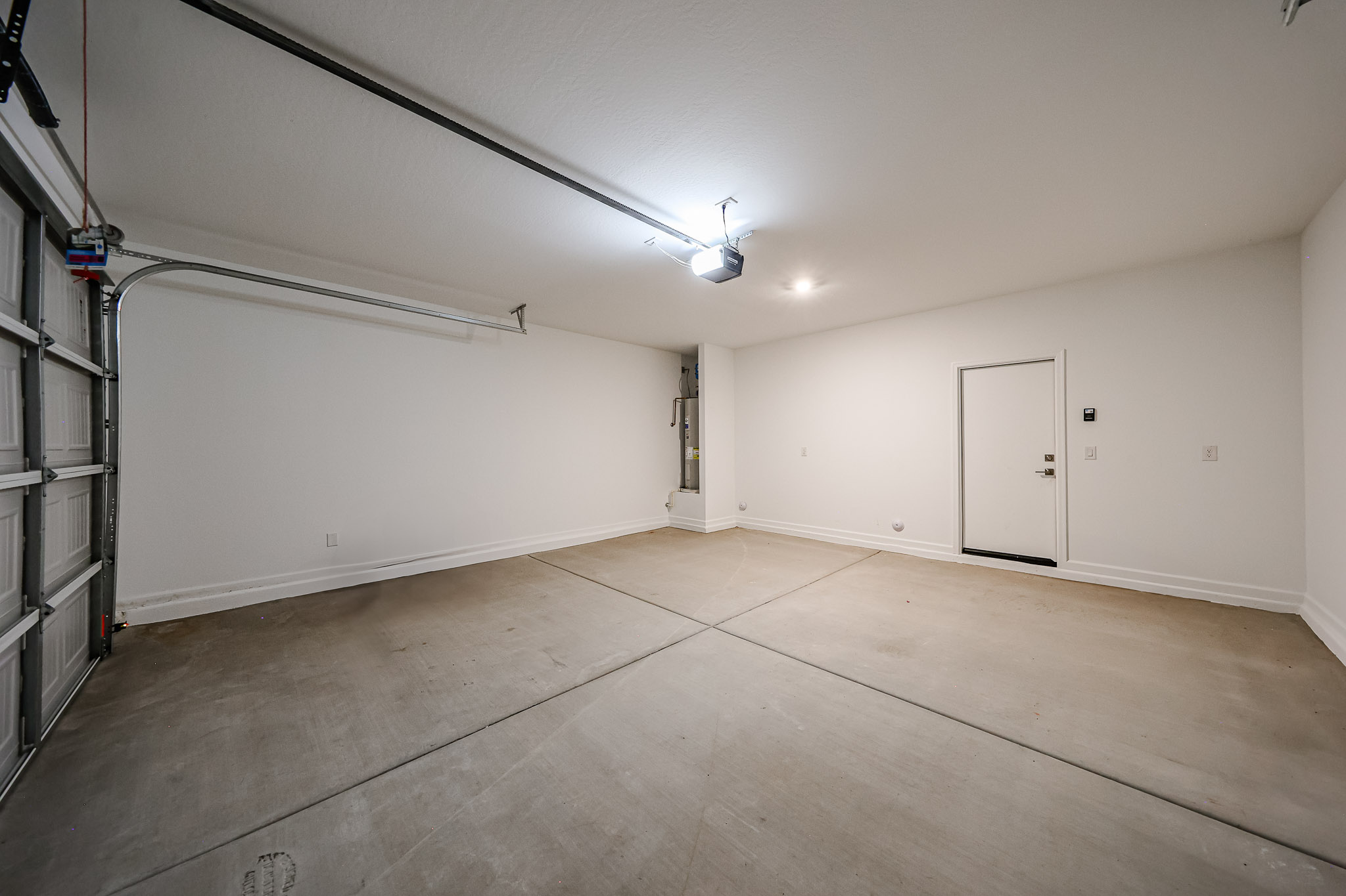 A room with a wood floor and white walls.