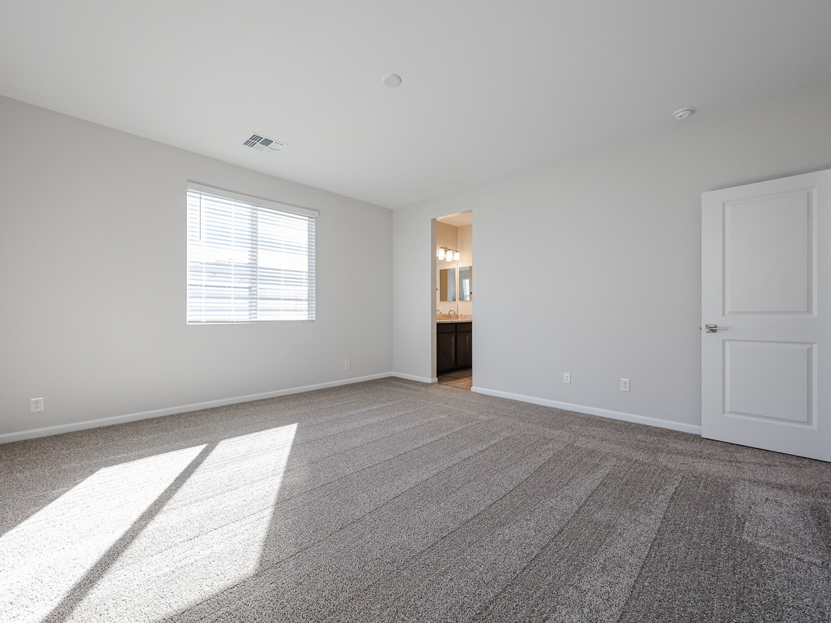 A room with a door and a window.