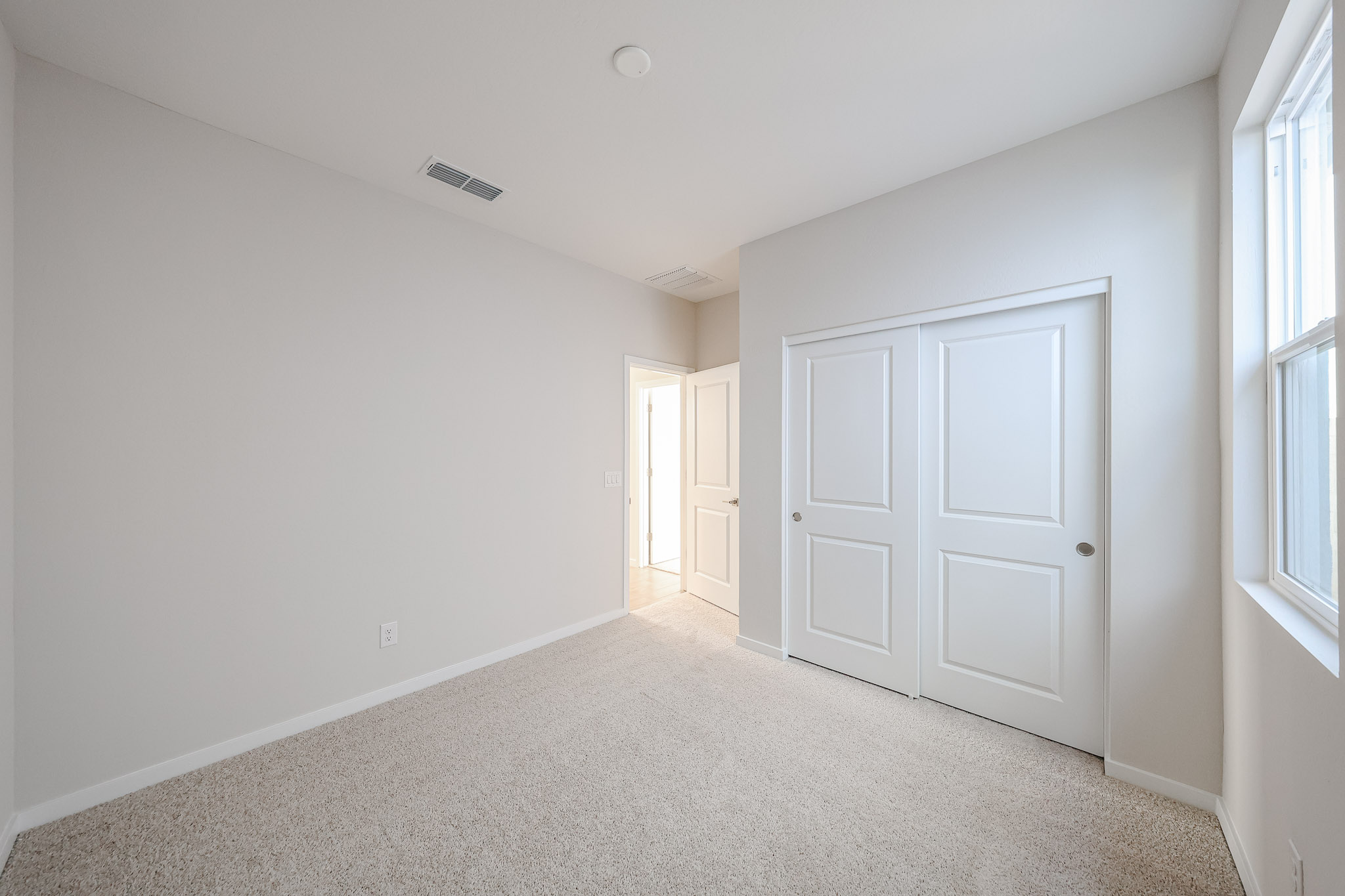 A room with white doors.