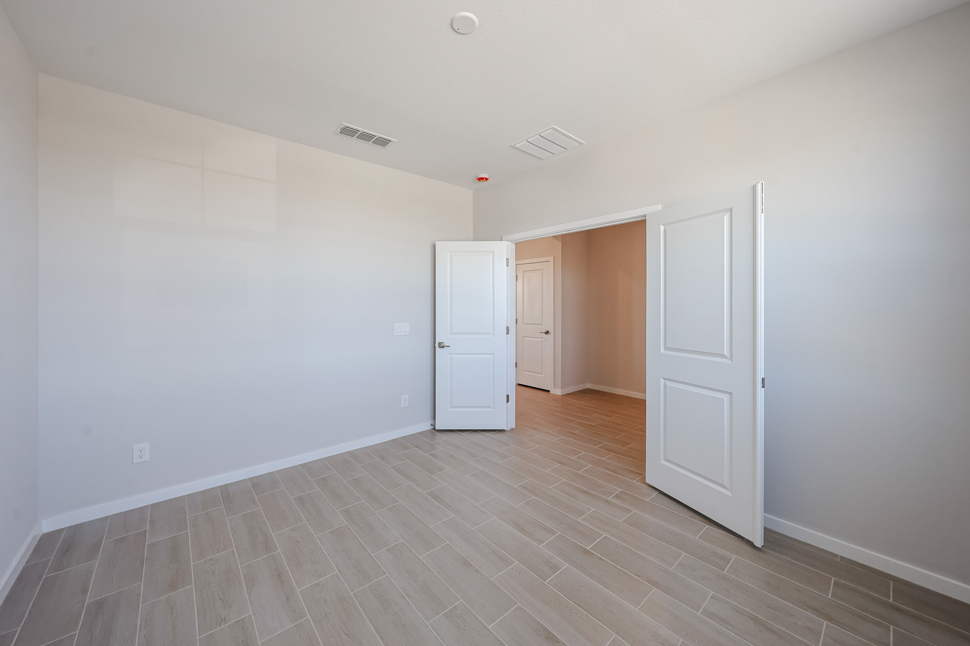 A room with white doors.