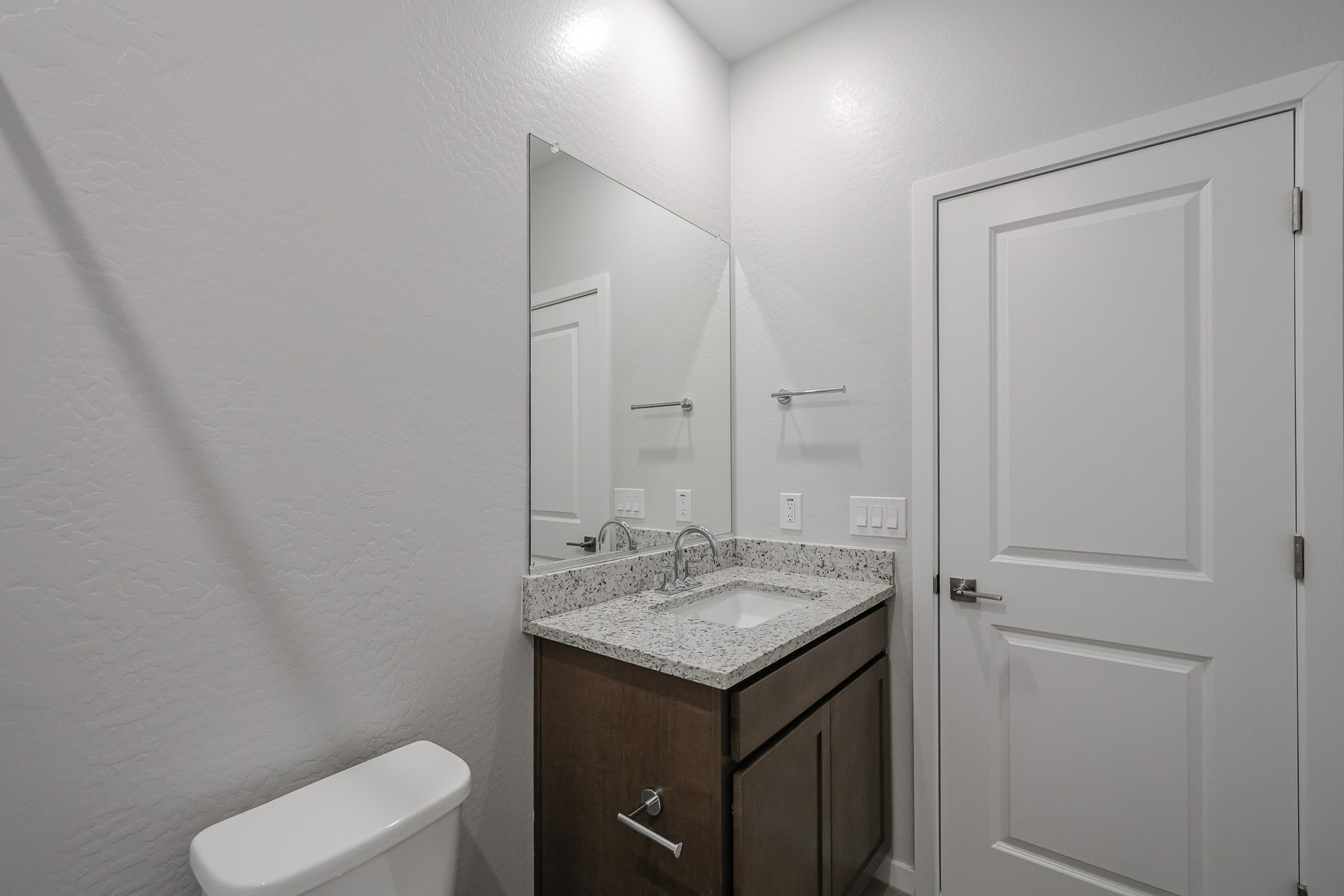 A bathroom with a sink and a toilet.
