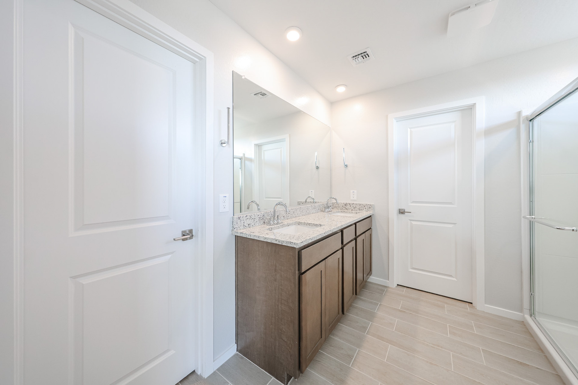 A bathroom with a marble countertop.