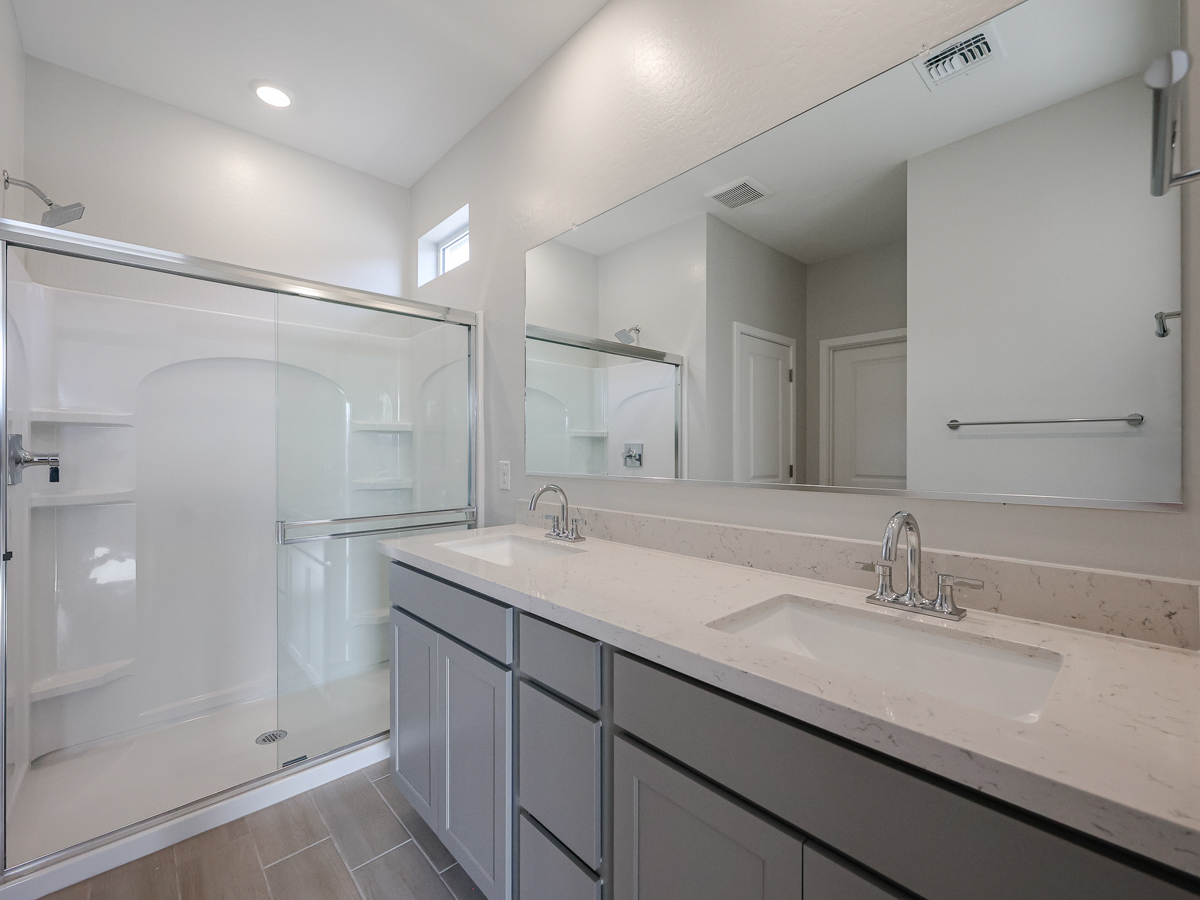 A bathroom with a glass shower.