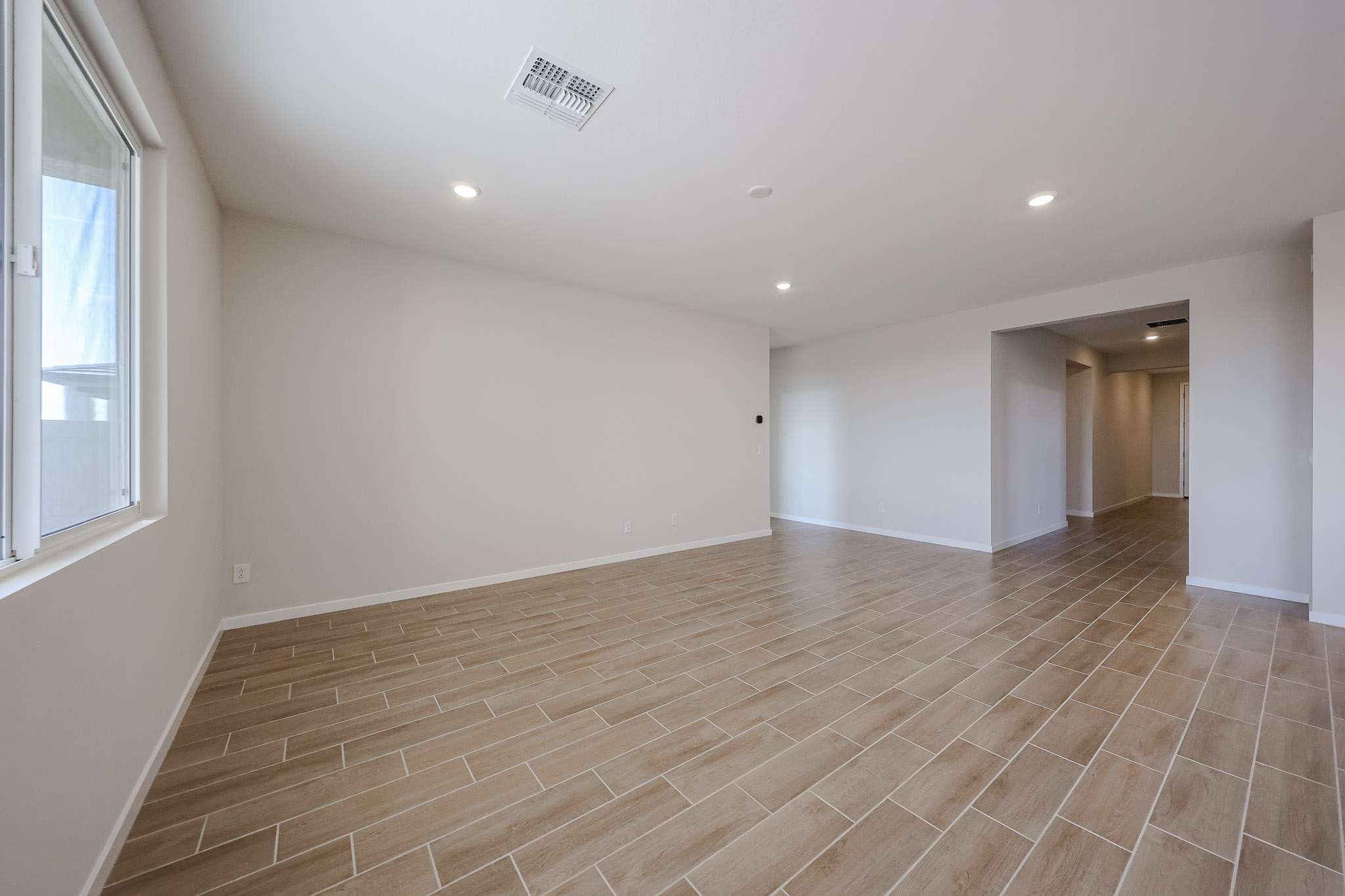A room with a wood floor.