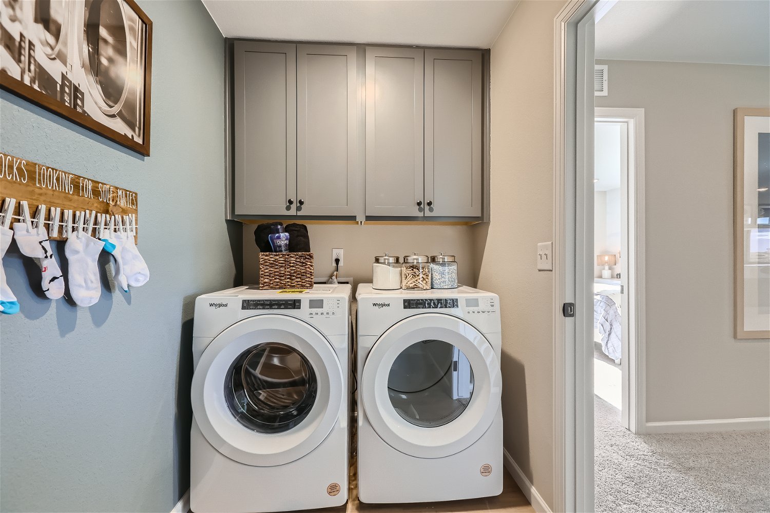 A laundry room with a washer and dryer.