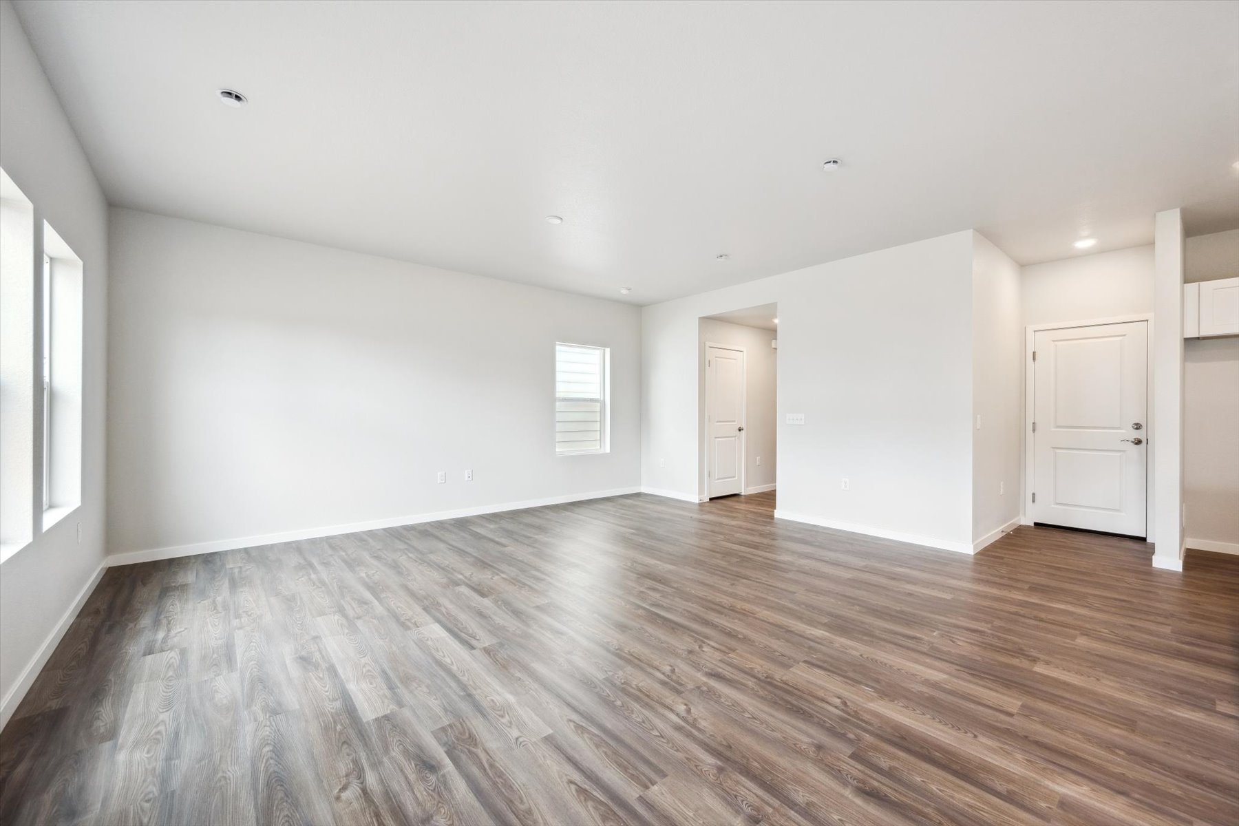 A room with wood floors.