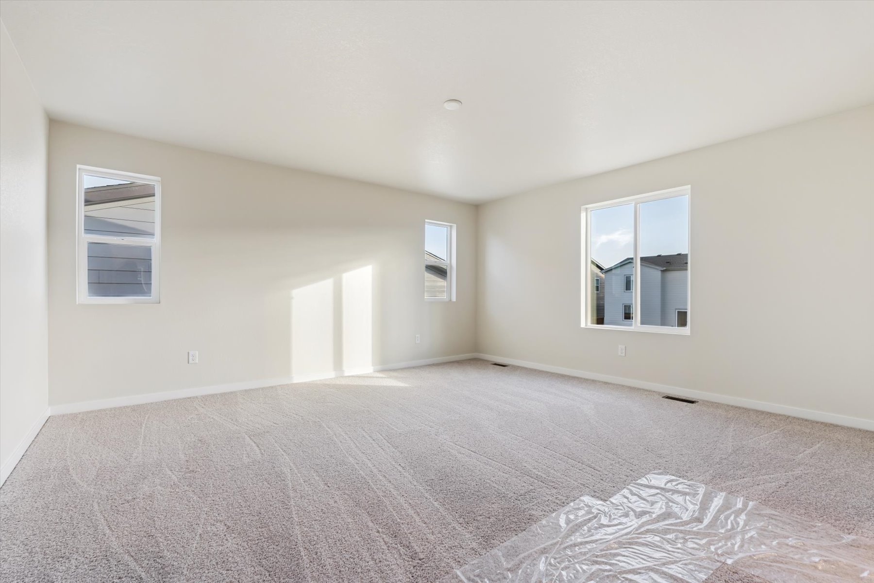 A room with a bed and a window.