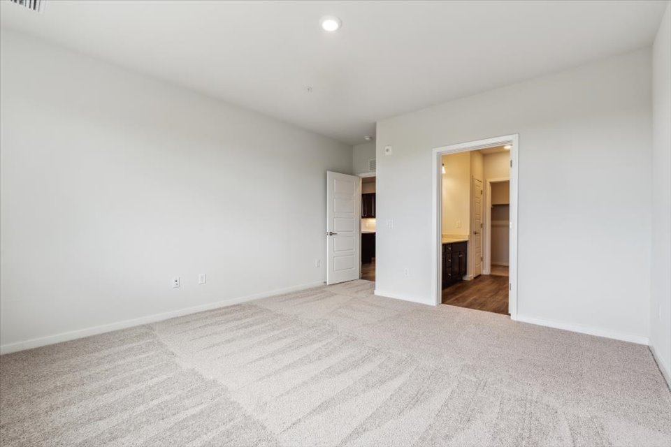 A hallway with white walls.