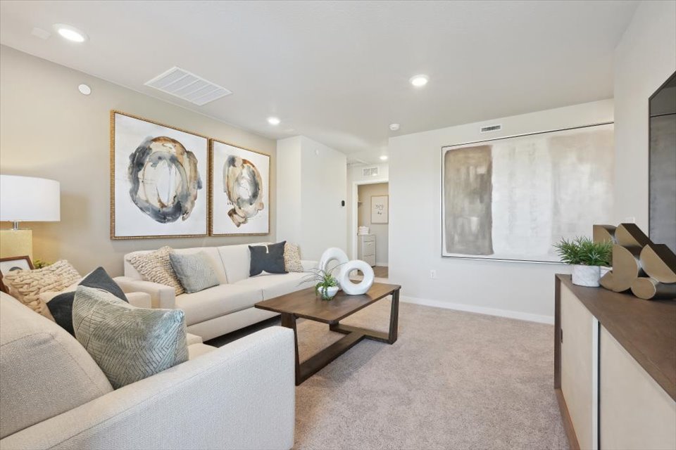 A living room with a couch and a coffee table.