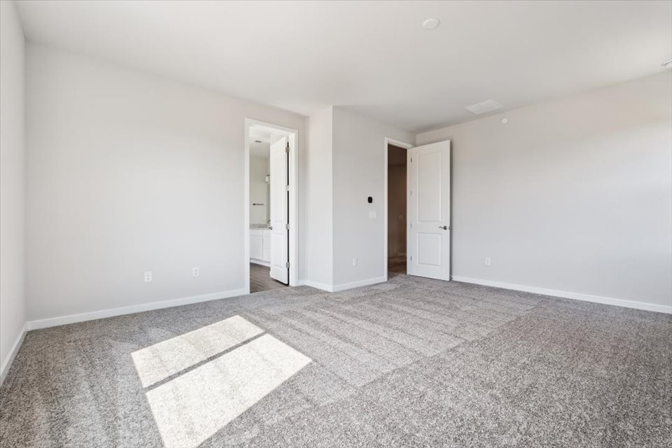 A hallway with white walls.