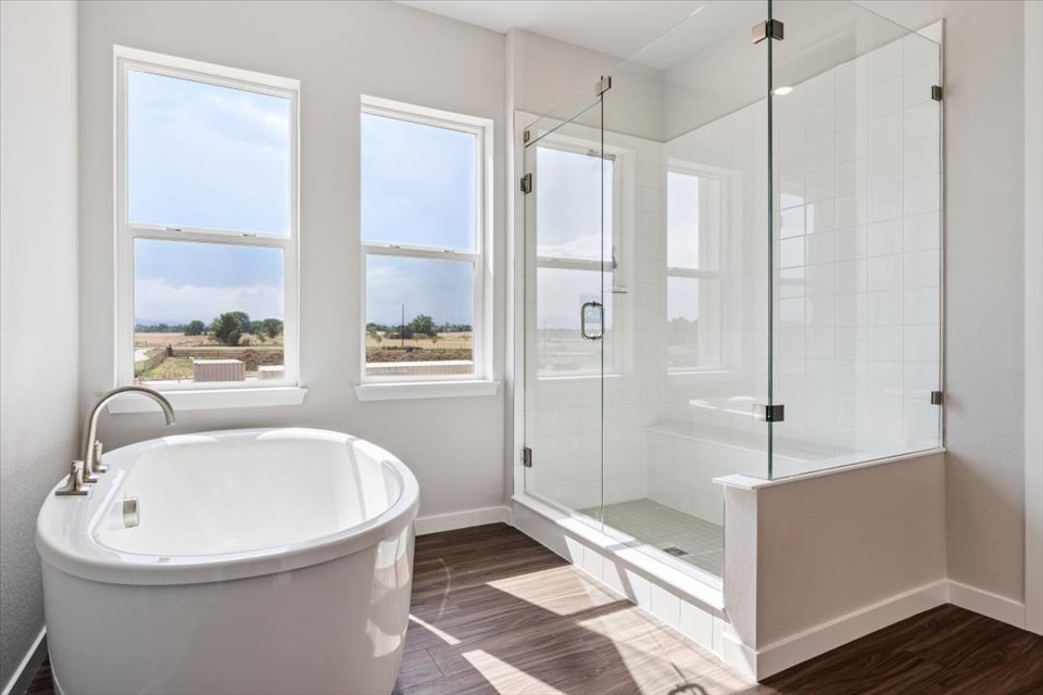 A bathroom with a tub and a sink.