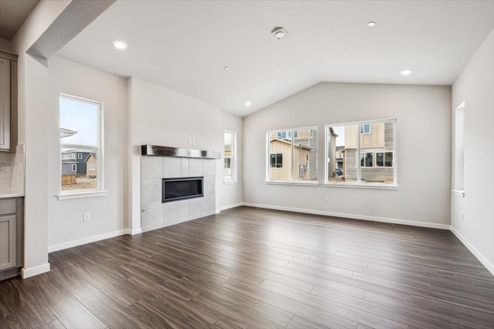 A large kitchen with white walls.