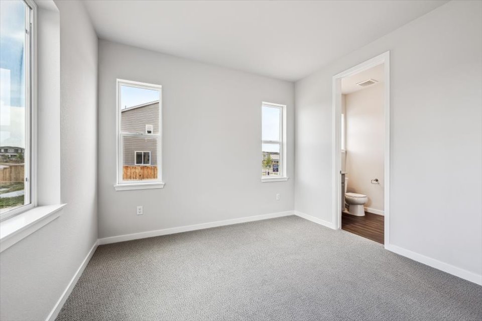 A bathroom with a toilet and a sink.