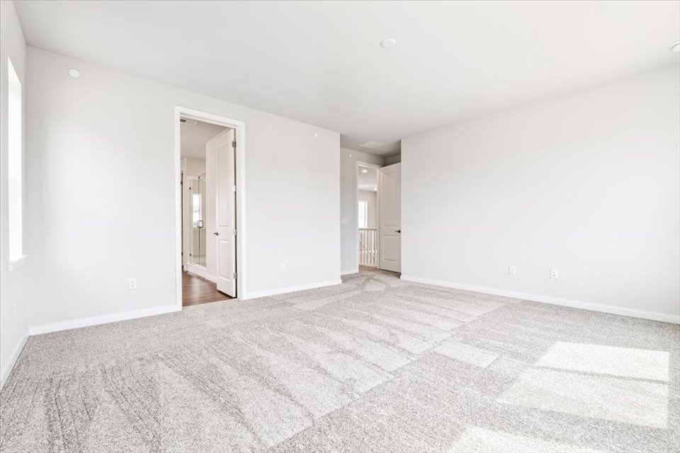 A hallway with white walls.