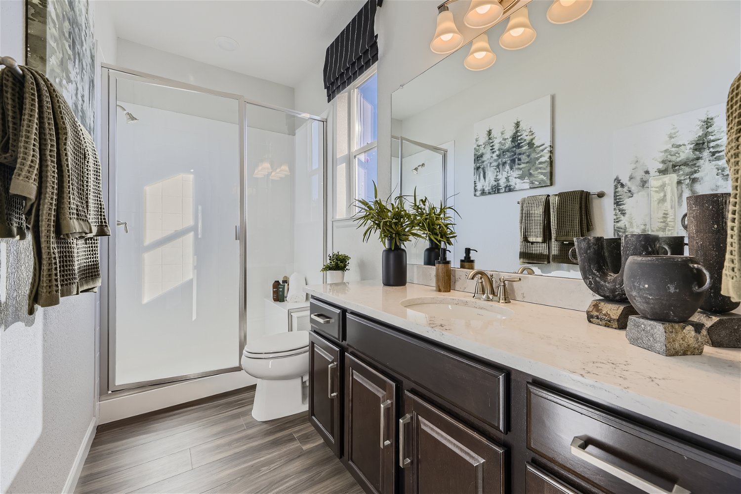 A bathroom with a marble countertop.