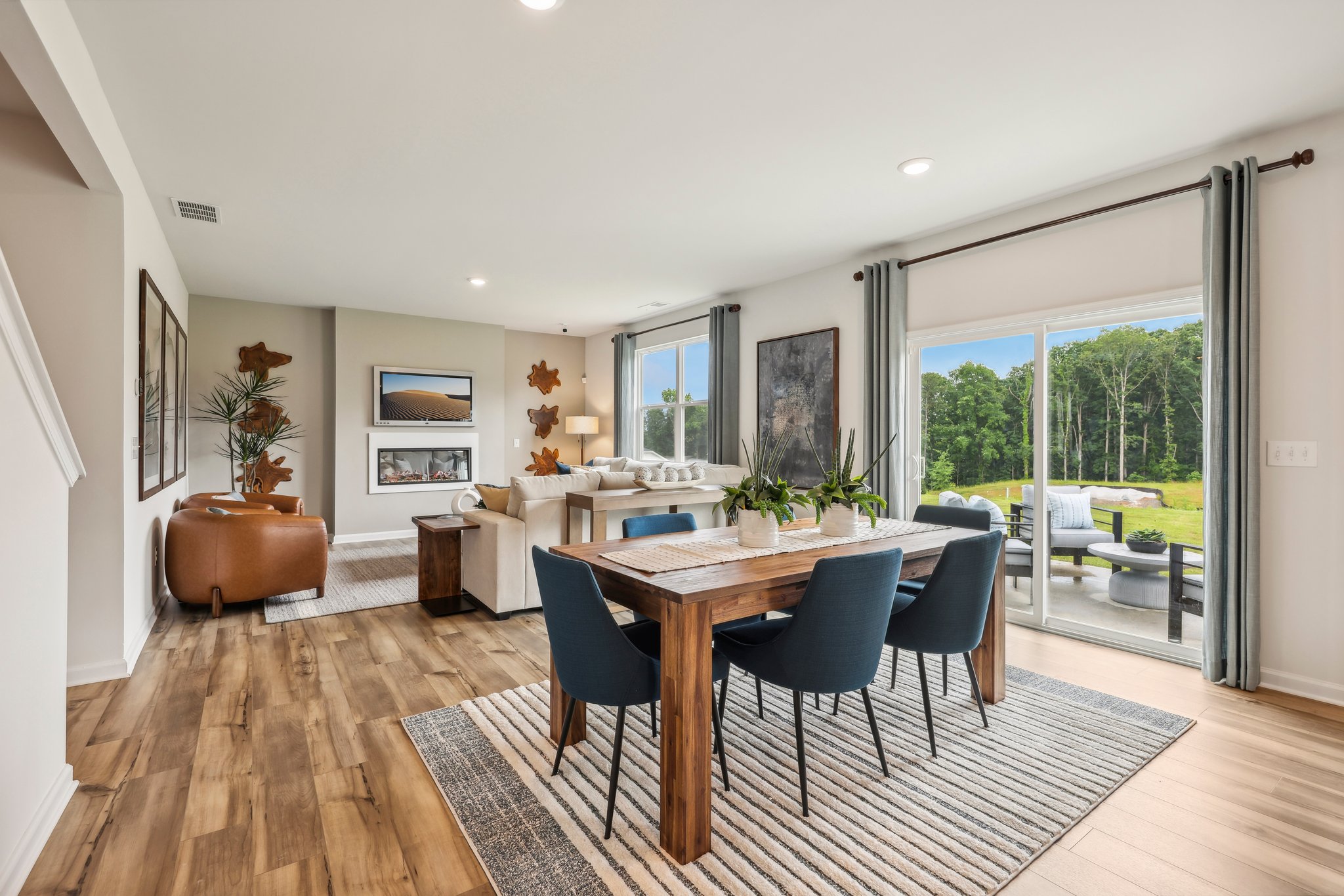 A dining room with a large table.