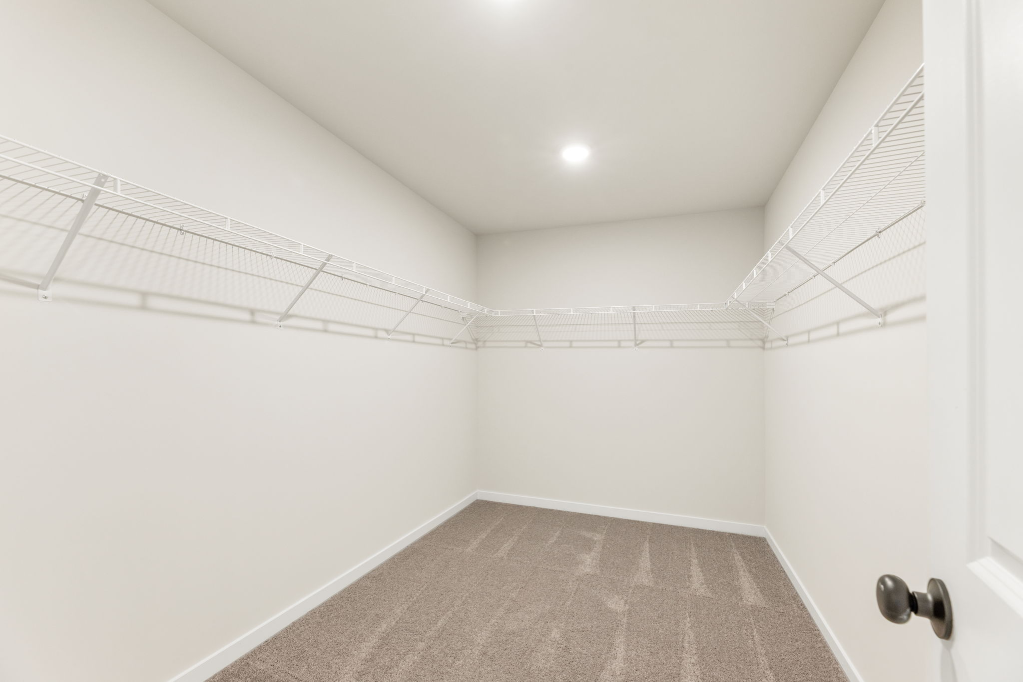 A hallway with white walls.