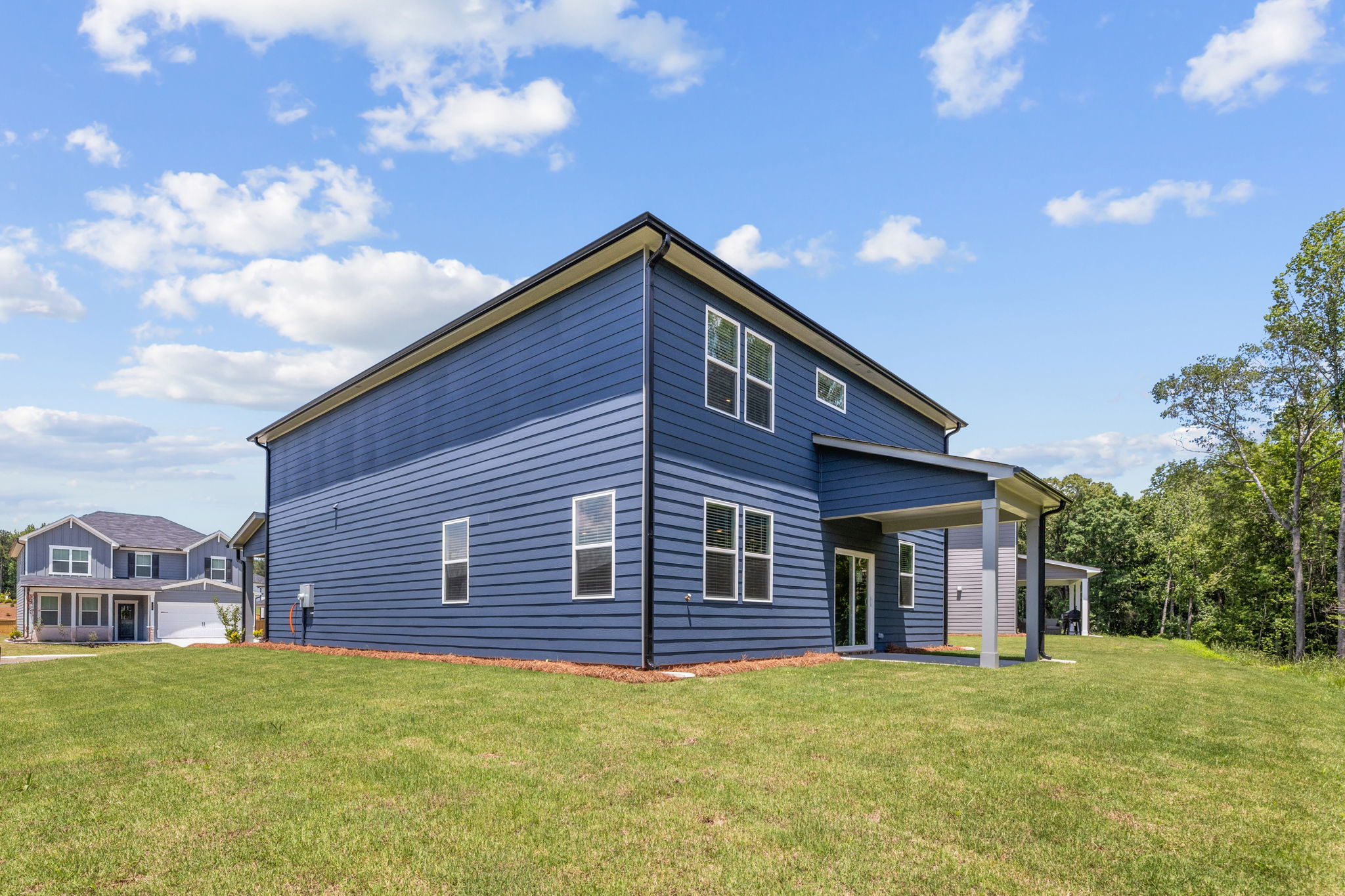 A house with a grass yard.
