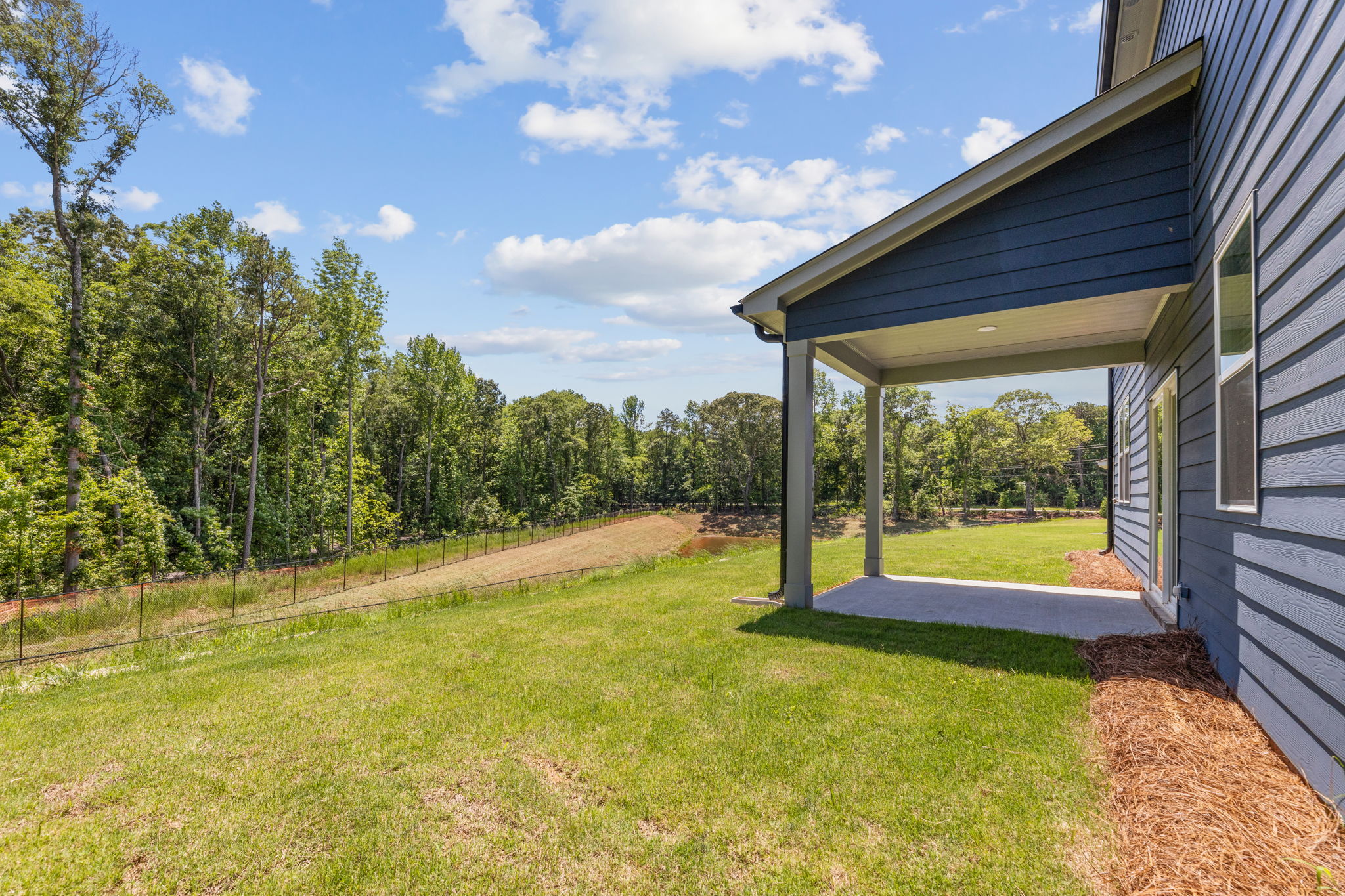 A house with a grass yard.