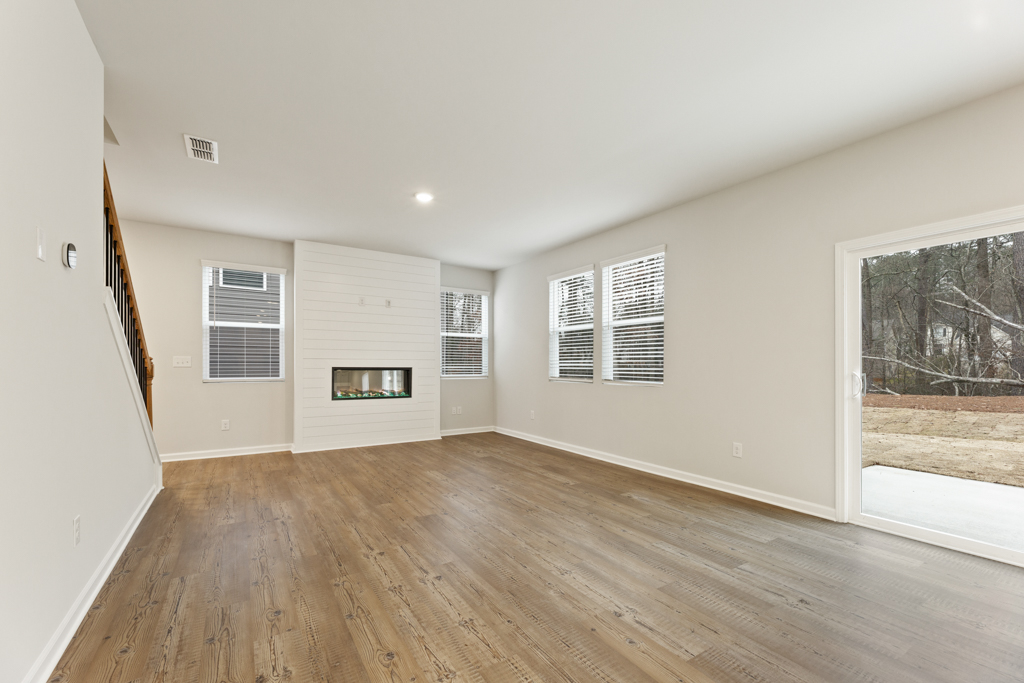 A room with a wood floor and a wood floor.