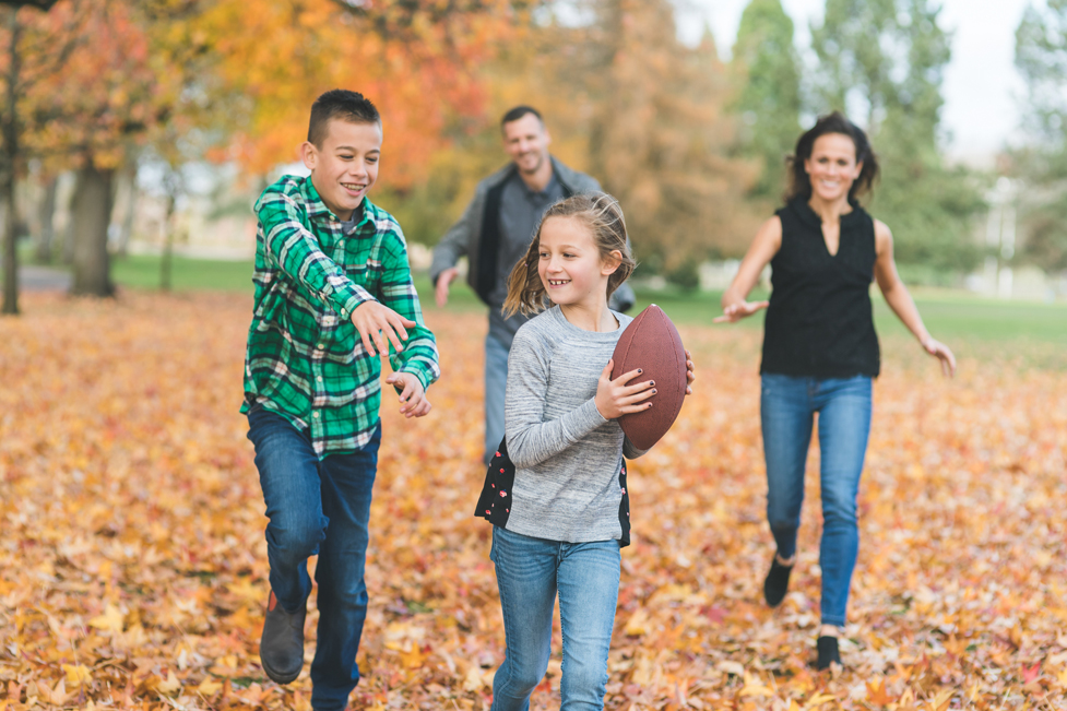 A group of people walking in a park.