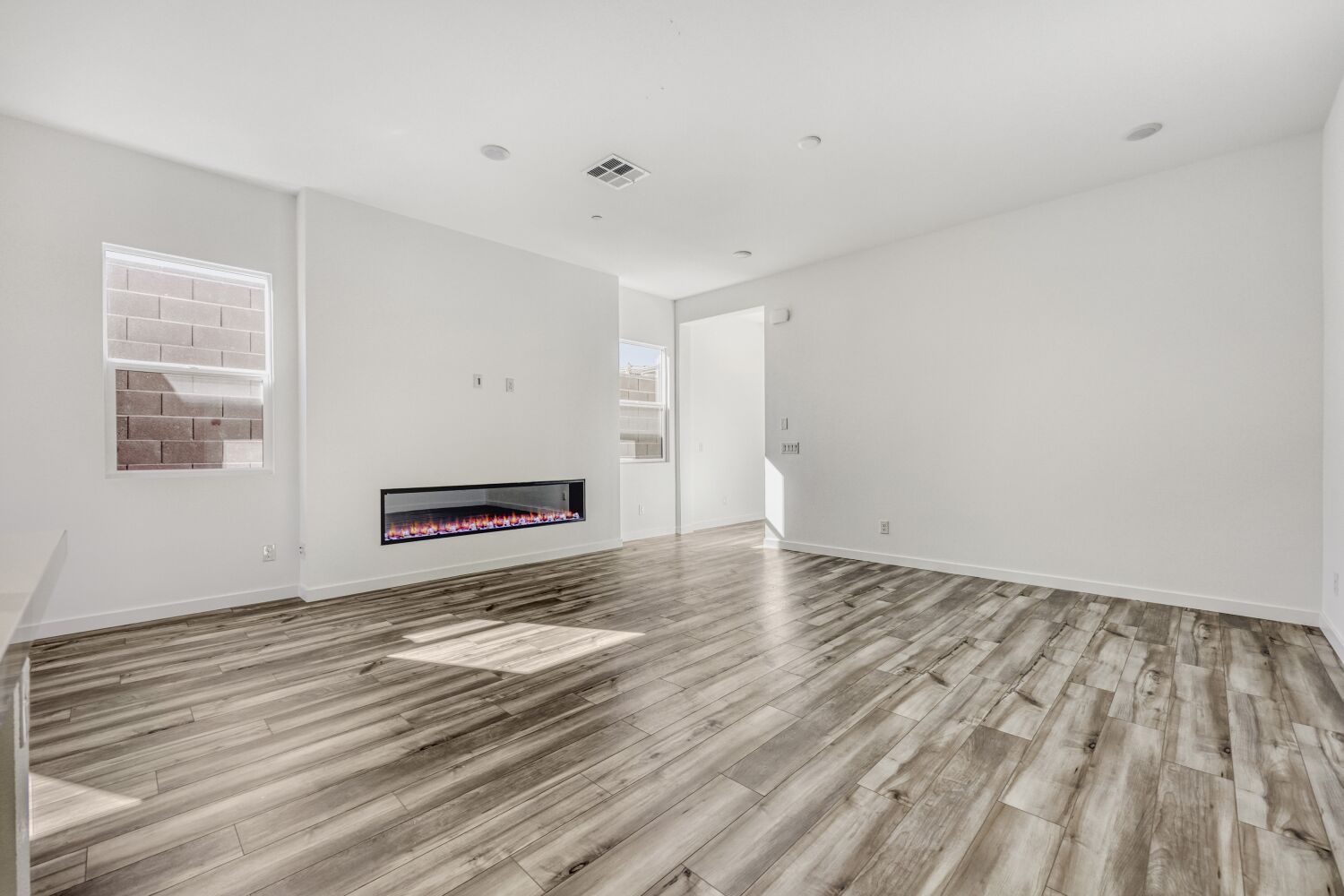 A room with a wood floor and a wood floor.
