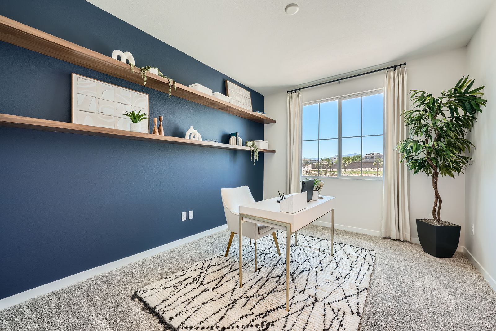 A room with a table and chairs.