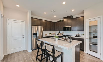 A kitchen with a marble island.
