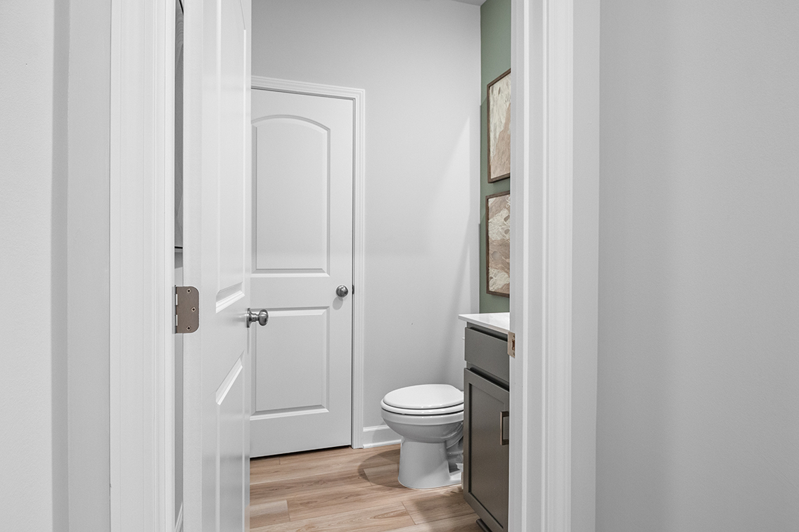 A bathroom with white doors.