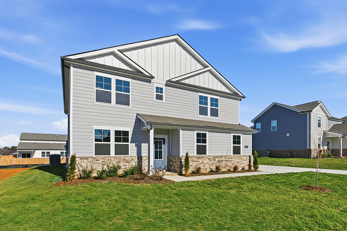 A house with a grass yard.