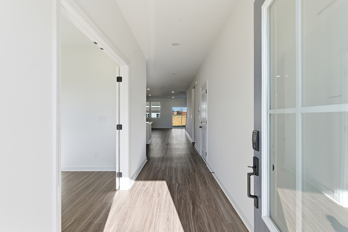 A hallway with white doors.