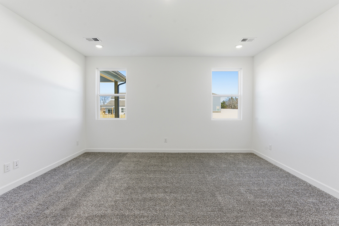 A room with a few windows.